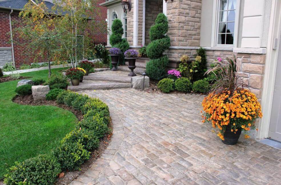 Structured Evergreen Garden Remodel Beds with Colorful Planters