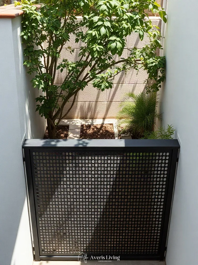 Blackened steel in a cozy backyard privacy fence layout